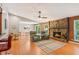 Open-concept living room featuring a stone fireplace, and natural light at 4425 Reef Rd, Marietta, GA 30066