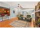 Stylish living room with a stone fireplace, hardwood floors, and bar at 4425 Reef Rd, Marietta, GA 30066