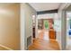 View of entry hall to living room with fireplace, hardwood floors, and natural light at 4425 Reef Rd, Marietta, GA 30066