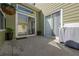 Spacious back patio with sliding doors, grill, and potted plants, ideal for outdoor gatherings and relaxation at 4510 Flowering Br, Powder Springs, GA 30127
