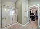 Bright bathroom with a glass shower door and a door to the walk in closet at 4510 Flowering Br, Powder Springs, GA 30127