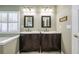 Bathroom features a double vanity and natural light from shuttered windows at 4510 Flowering Br, Powder Springs, GA 30127