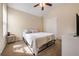 Bedroom with neutral color palette, ceiling fan, carpet flooring, and a double door closet at 4510 Flowering Br, Powder Springs, GA 30127