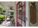 Charming front door with glass panels, welcome sign, and cozy seating on the inviting front porch at 4510 Flowering Br, Powder Springs, GA 30127