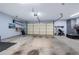 Spacious garage with ample storage, shelving, and work area, ready for projects at 4510 Flowering Br, Powder Springs, GA 30127