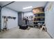 Garage with organization solutions, storage cabinets, work bench and pegboard tool organization at 4510 Flowering Br, Powder Springs, GA 30127