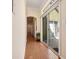 Hallway features hardwood flooring, natural light from glass sliding doors to an outdoor patio at 4510 Flowering Br, Powder Springs, GA 30127