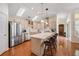 Bright kitchen with stainless steel appliances, skylights and a large kitchen island with bar stool seating at 4510 Flowering Br, Powder Springs, GA 30127