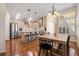 Bright kitchen with stainless appliances, island with seating, and attached dining area under a chandelier at 4510 Flowering Br, Powder Springs, GA 30127