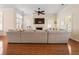 Spacious living room featuring a fireplace, a large sectional sofa, and hardwood floors at 4510 Flowering Br, Powder Springs, GA 30127