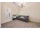 Cozy living room features a neutral palette, plush carpeting, and ample natural light from shuttered windows at 4510 Flowering Br, Powder Springs, GA 30127