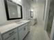 Stylish bathroom with double vanities, subway tile shower, and modern fixtures at 5022 Buice Crest Court, Buford, GA 30518