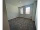 Bright bedroom with two windows and neutral carpet flooring at 5022 Buice Crest Court, Buford, GA 30518