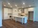 Spacious kitchen with white cabinets, stainless steel appliances, and a large center island at 5022 Buice Crest Court, Buford, GA 30518