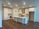 Spacious kitchen with white cabinets, stainless steel appliances, and a large center island at 5022 Buice Crest Court, Buford, GA 30518