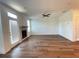 Cozy living room with a fireplace, hardwood floors, and access to a patio at 5022 Buice Crest Court, Buford, GA 30518