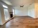 Cozy living room with a fireplace, hardwood floors, and access to a patio at 5022 Buice Crest Court, Buford, GA 30518