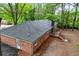A high angle exterior view showing the backyard deck area and brick facade at 800 Kiowa Ne Dr, Marietta, GA 30060