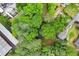 Aerial view of home surrounded by lush green trees and neighborhood streets at 800 Kiowa Ne Dr, Marietta, GA 30060