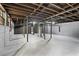 Unfinished basement with exposed pipes, offering potential for customization and storage at 800 Kiowa Ne Dr, Marietta, GA 30060