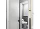 En-suite bathroom features wood paneled walls and modern toilet at 800 Kiowa Ne Dr, Marietta, GA 30060