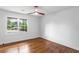 Bright bedroom with hardwood floors and large windows overlooking the yard at 800 Kiowa Ne Dr, Marietta, GA 30060