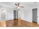 Bedroom with hardwood floors, a ceiling fan, and closet doors with doors open to other rooms at 800 Kiowa Ne Dr, Marietta, GA 30060