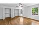 Spacious bedroom features hardwood floors, a ceiling fan, and double closets at 800 Kiowa Ne Dr, Marietta, GA 30060