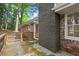View of deck with black metal railings and red brick chimney at 800 Kiowa Ne Dr, Marietta, GA 30060