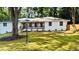 Well-maintained home with a charming covered porch and a beautifully landscaped yard at 800 Kiowa Ne Dr, Marietta, GA 30060