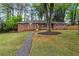 Beautiful brick home with a well-manicured lawn and inviting front porch, perfect for relaxing at 800 Kiowa Ne Dr, Marietta, GA 30060
