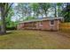 Attractive brick home with a covered front porch with landscaping at 800 Kiowa Ne Dr, Marietta, GA 30060