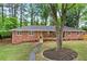 Charming brick home featuring a covered front porch and a beautifully landscaped front yard at 800 Kiowa Ne Dr, Marietta, GA 30060