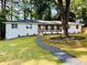 Inviting home with a landscaped front yard and a cozy covered porch at 800 Kiowa Ne Dr, Marietta, GA 30060