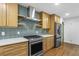 Modern kitchen features stainless steel appliances and wood cabinets at 800 Kiowa Ne Dr, Marietta, GA 30060