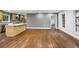 Open-concept area shows an island in the kitchen and bright windows overlooking the outdoor view at 800 Kiowa Ne Dr, Marietta, GA 30060