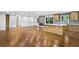 Open-concept living area with a view of the kitchen and hardwood floors throughout the home at 800 Kiowa Ne Dr, Marietta, GA 30060