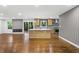 Open floor plan with a view of the kitchen with stainless appliances and hardwood flooring at 800 Kiowa Ne Dr, Marietta, GA 30060