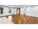 Open-concept living area features gleaming hardwood floors and a built-in bench near bright windows at 800 Kiowa Ne Dr, Marietta, GA 30060