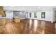 Spacious open-concept area with hardwood floors, including a kitchen island and bright windows at 800 Kiowa Ne Dr, Marietta, GA 30060