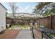 Fenced backyard with patio, seating, and lush greenery, providing a relaxing outdoor space at 10900 Wittenridge Dr # I4, Alpharetta, GA 30022