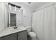 Clean bathroom with gray cabinets, modern fixtures, and bright lighting at 10900 Wittenridge Dr # I4, Alpharetta, GA 30022