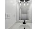 This bathroom features a contemporary sink and a large mirror with stylish lighting at 10900 Wittenridge Dr # I4, Alpharetta, GA 30022