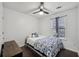 Comfortable bedroom featuring hardwood floors, large windows, and contemporary fixtures at 10900 Wittenridge Dr # I4, Alpharetta, GA 30022