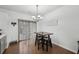 Dining area features hardwood floors and a sliding door leading to the backyard at 10900 Wittenridge Dr # I4, Alpharetta, GA 30022