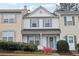 Charming two-story townhouse with blue shutters and a well-maintained front garden at 10900 Wittenridge Dr # I4, Alpharetta, GA 30022