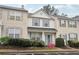 Pleasant townhouse with a covered entry, vibrant flower bushes, and manicured landscaping at 10900 Wittenridge Dr # I4, Alpharetta, GA 30022