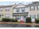 Attractive townhouse with blue shutters and a well-manicured front yard with flowering bushes at 10900 Wittenridge Dr # I4, Alpharetta, GA 30022