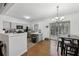 Kitchen with gray cabinets and white countertops with view to the dining and living area at 10900 Wittenridge Dr # I4, Alpharetta, GA 30022