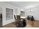 Bright kitchen area with modern stools, sleek appliances, and open access to the dining area at 10900 Wittenridge Dr # I4, Alpharetta, GA 30022
